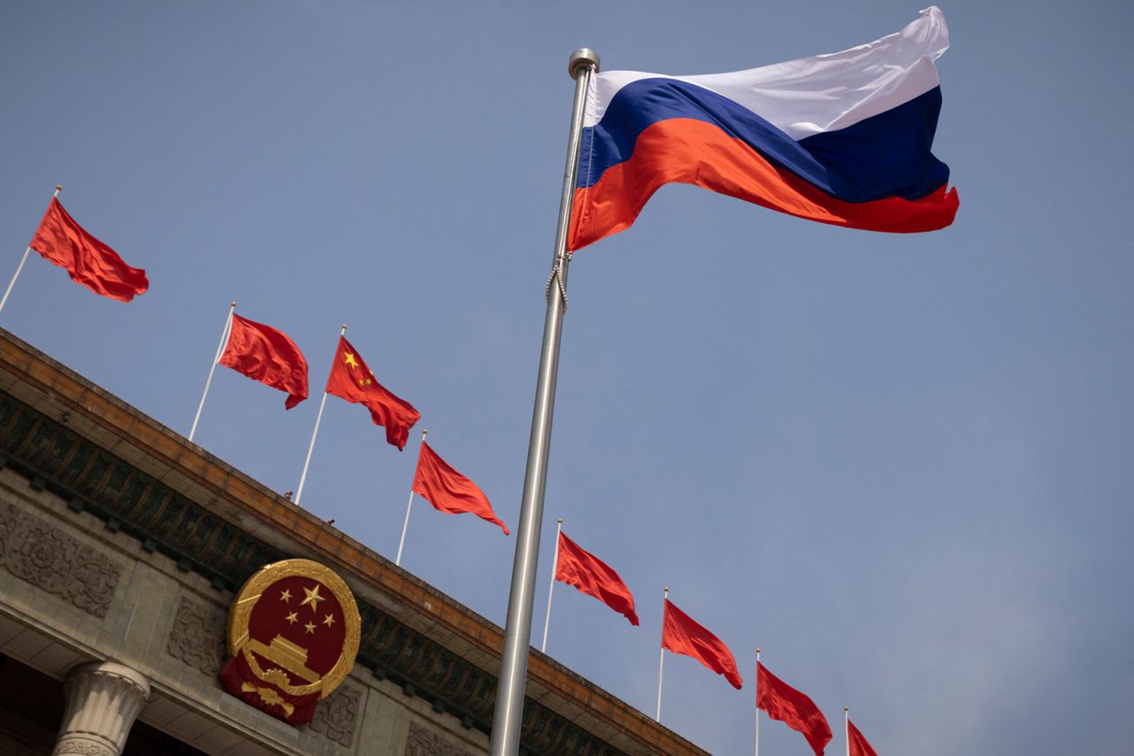 The Russian national flag fluters in front of the Great Hall of the People in Beijing on May 24.