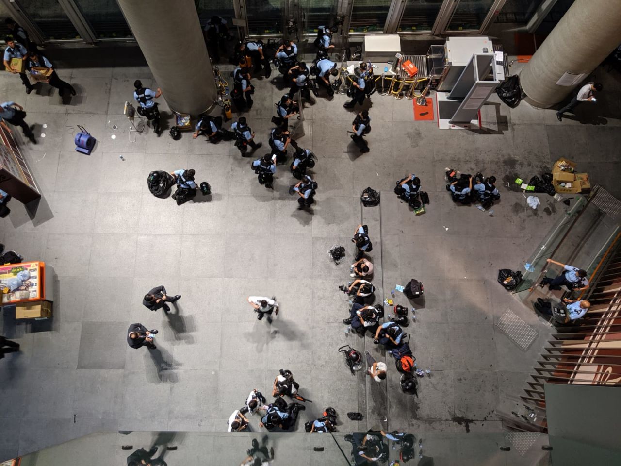 Police officers rest after a day of protests. 