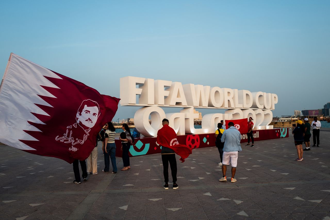 Fans gather around a FIFA World Cup Qatar 2022 sign on the Corniche on November 19, in Doha, Qatar.