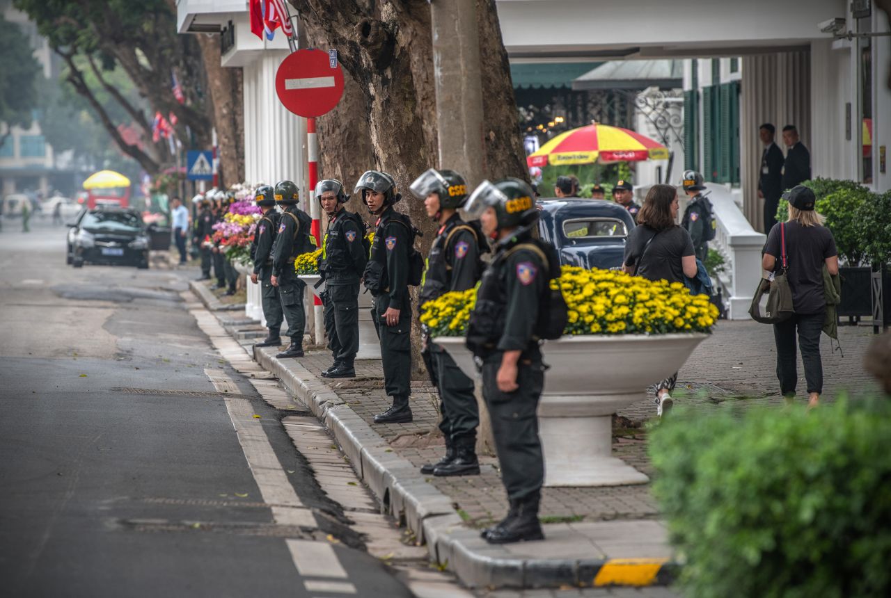 Police officers line up outside the Hotel Metropole in Hanoi where Kim and Trump will meet again on Thursday.