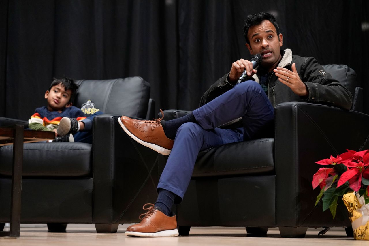 Vivek Ramaswamy speaks as his son Karthik, left, looks on during Rep. Randy Feenstra's "Faith and Family with the Feenstras" event on Saturday, December 9, in Sioux Center, Iowa. 