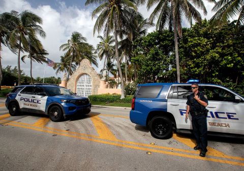 Local police presence stay outside Mar-a-Lago, the residence of former President Donald Trump, on August 9. 