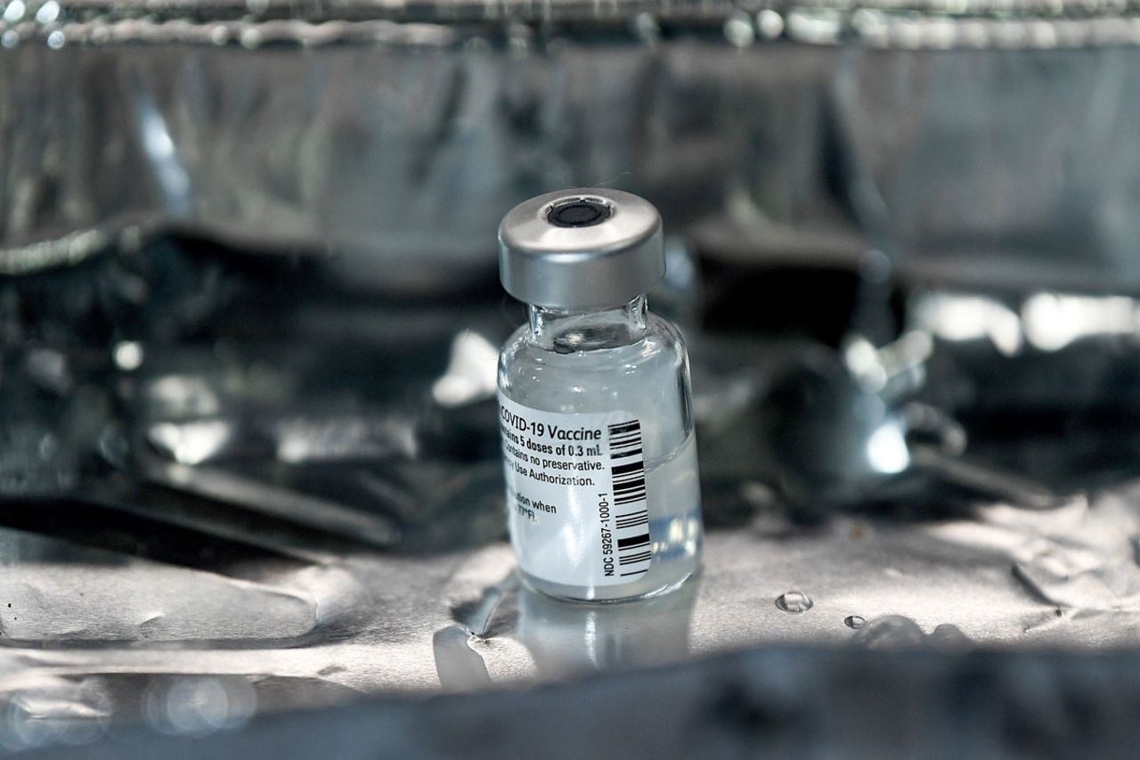 A phial of Pfizer-BioNTech Covid-19 vaccine is seen on a tray at the Louisa Jordan Hospital in Glasgow on Dec. 8 as the UK begins its biggest vaccination program.