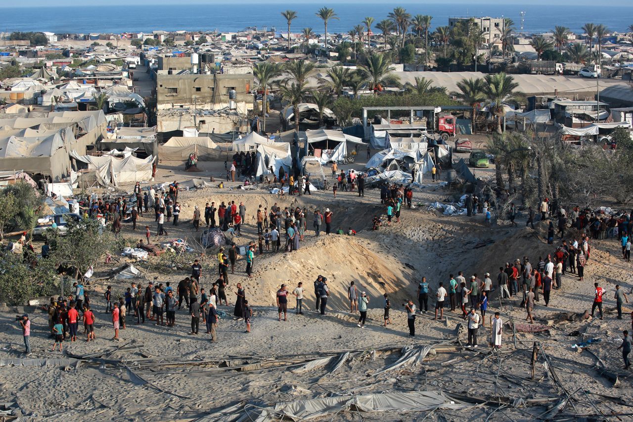 Palestinians inspect the damage at the site of Israeli strikes on a makeshift displacement camp in Al-Mawasi, Khan Younis, in the Gaza Strip on September 10.