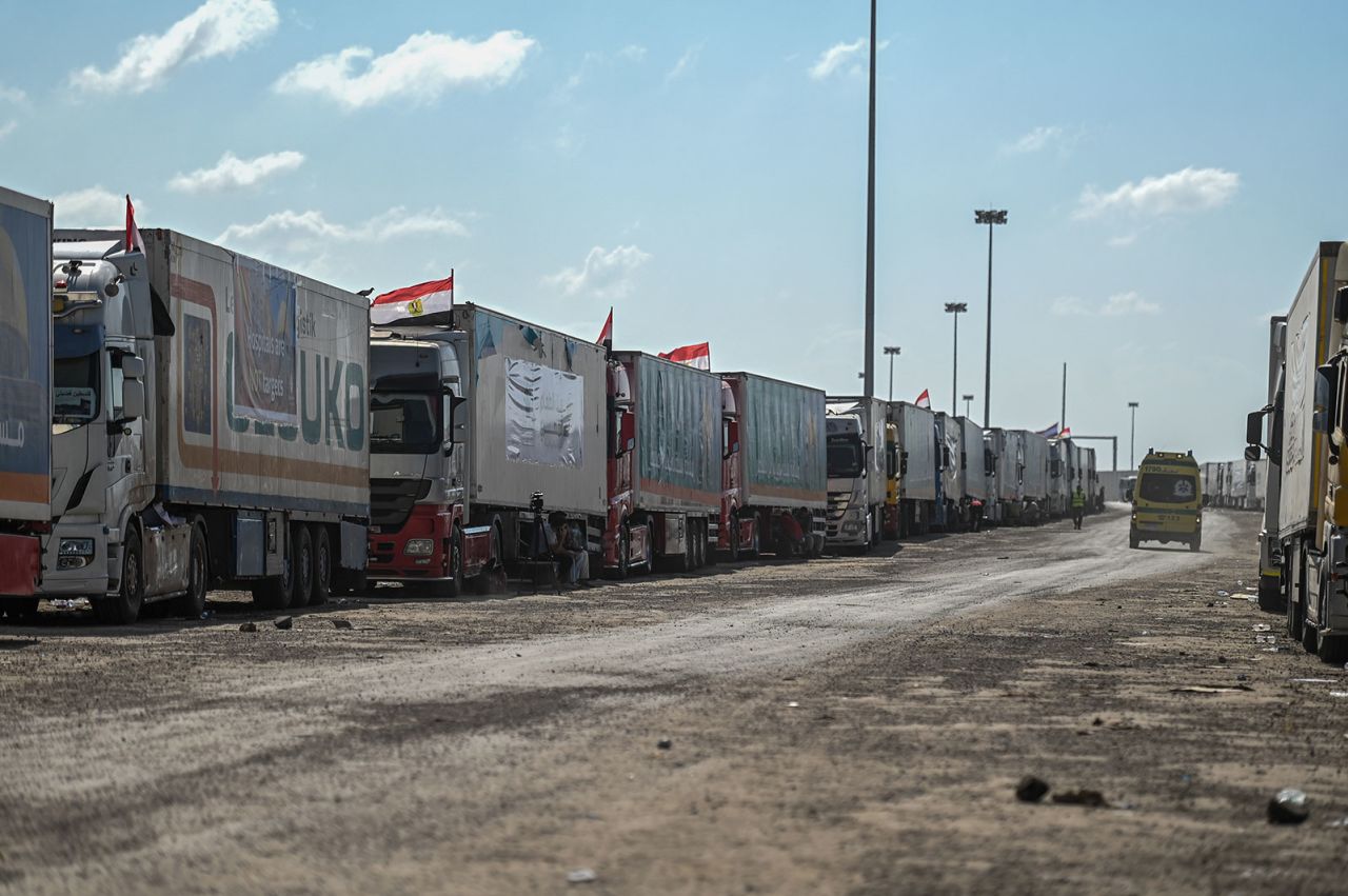 A convoy of trucks carrying humanitarian aid line up in Egypt near the Rafah border crossing on October 20.