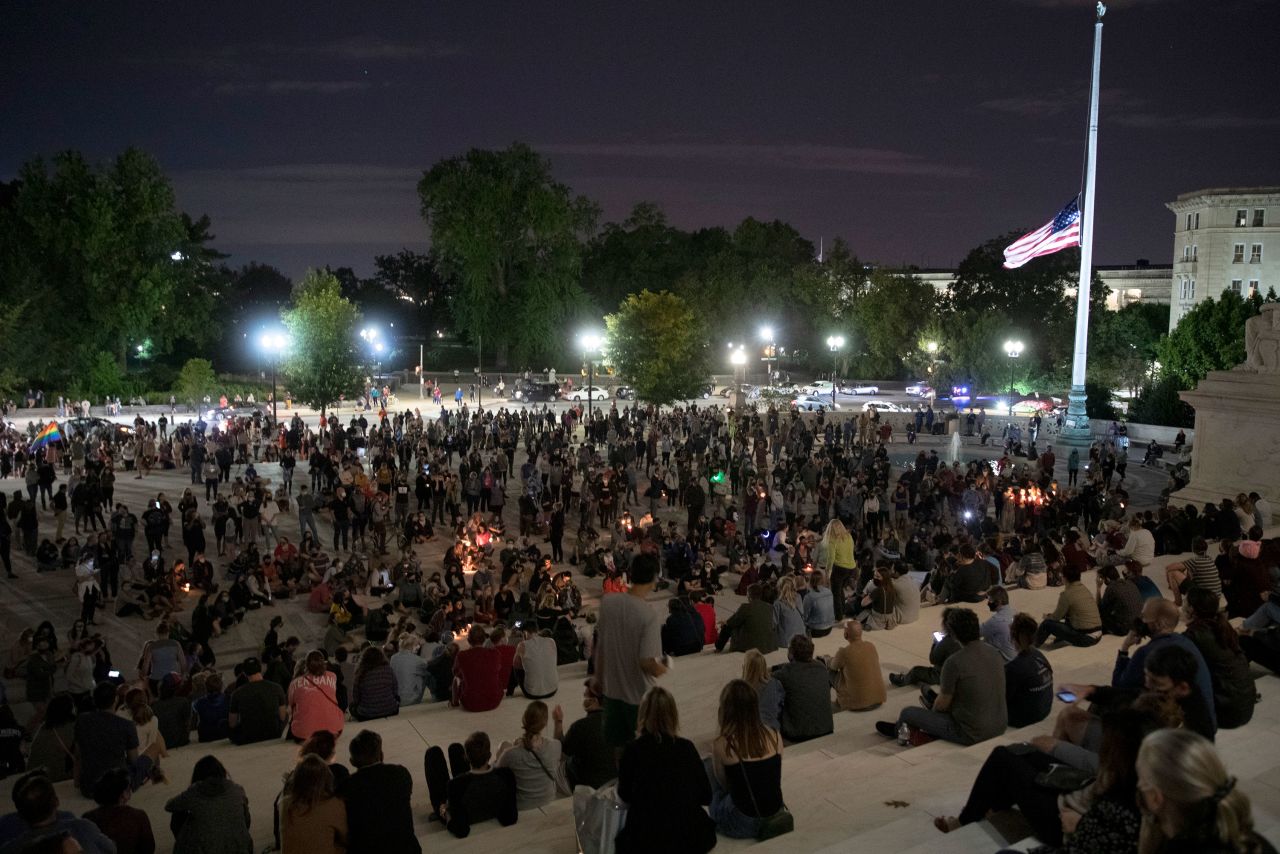 People gather to mourn the passing of Justice Ruth Bader Ginsburg outside the Supreme Court on September 18 in Washington, DC. 