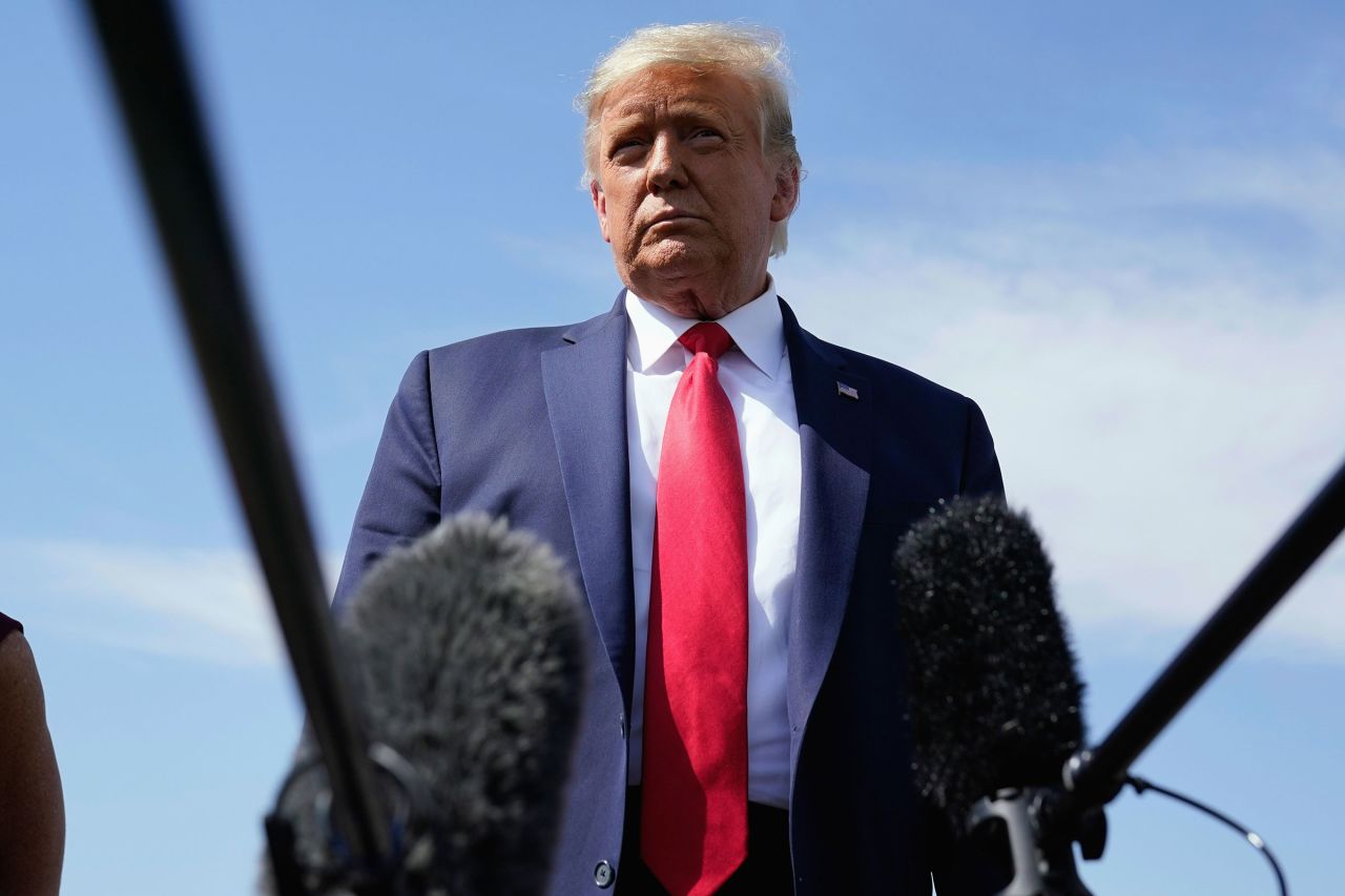 President Donald Trump talks to reporters at Phoenix Sky Harbor International Airport on October 19 in Phoenix, Arizona.