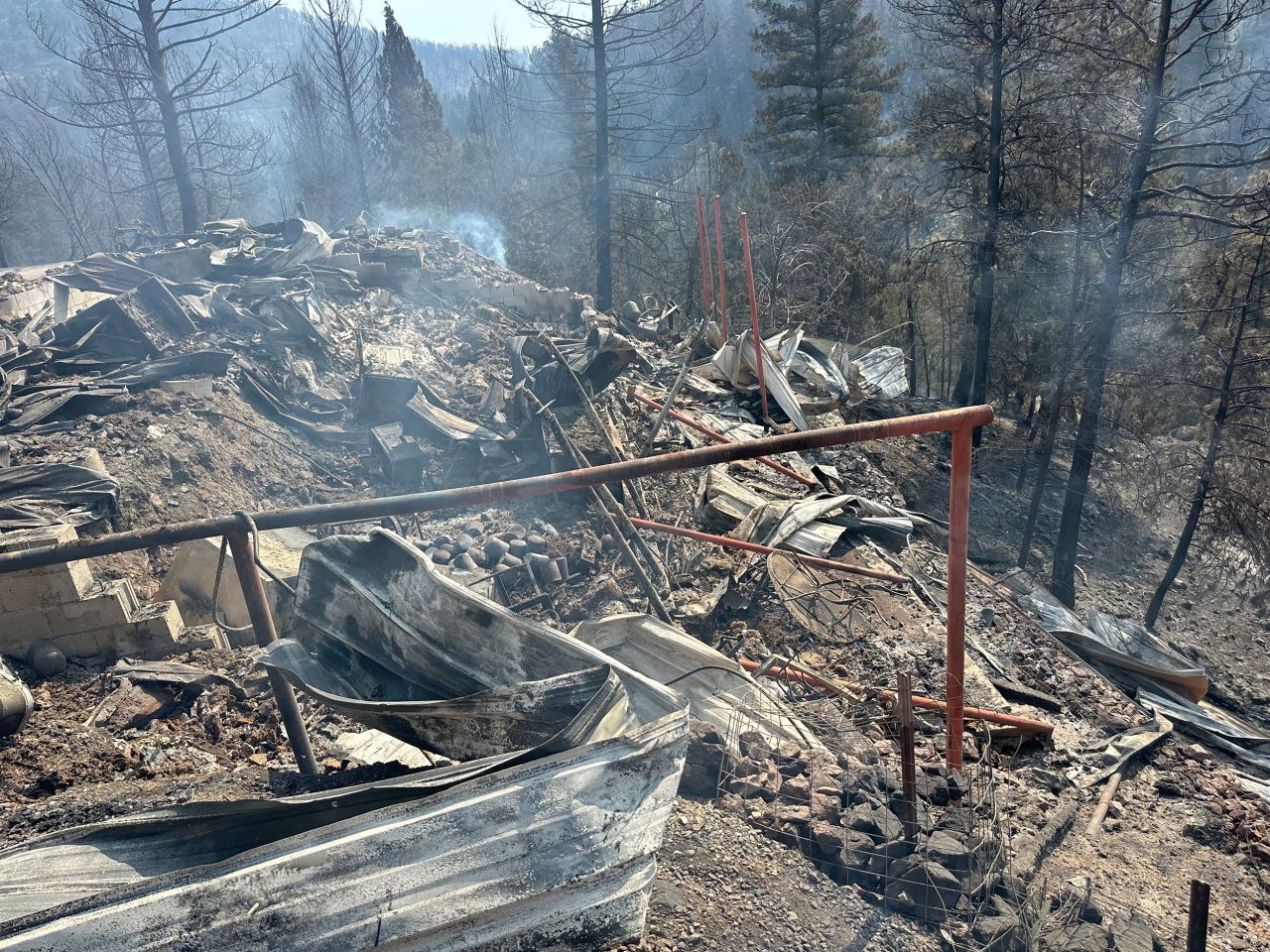 A destroyed house belonging to his friend is seen on Wednesday.