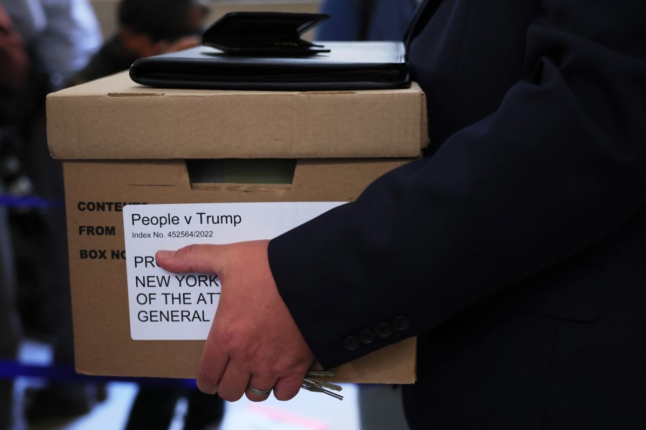 A box is carried at the courthouse before the start of the trial.?