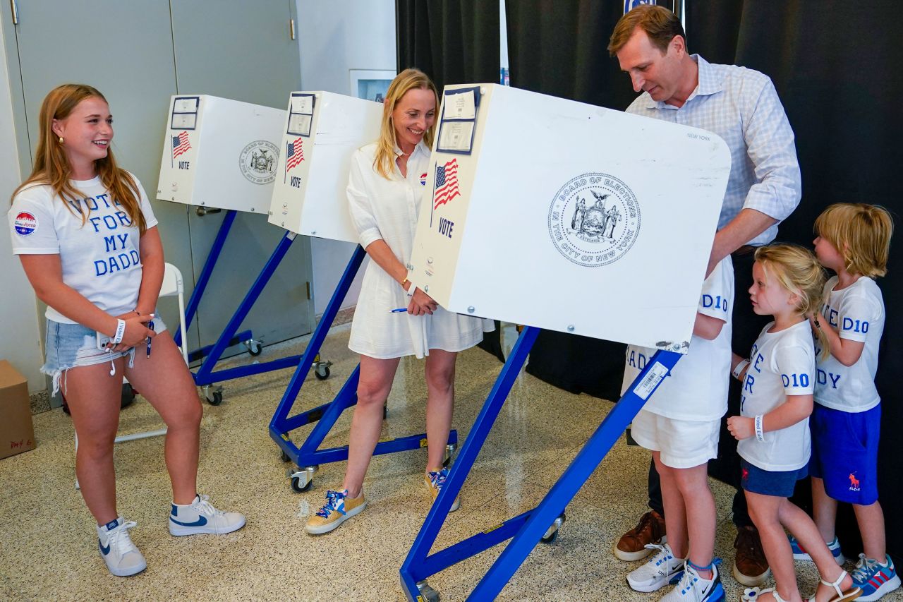 Dan Goldman is joined by his family as he votes early in the Democratic primary election on August 17.