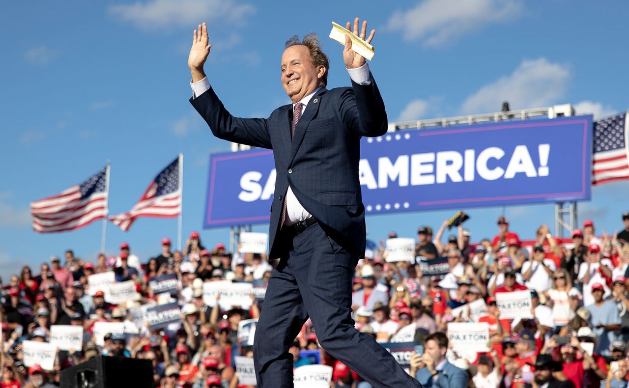 Ken Paxton waves to the crowd during a rally with former President Donald Trump on October 22 in Robstown, Texas. 