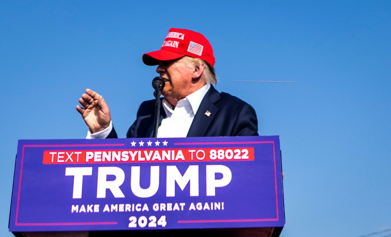 Former President Donald Trump speaks onstage as gunshots are fired at his campaign rally in Butler, Pennsylvania, on Saturday. 