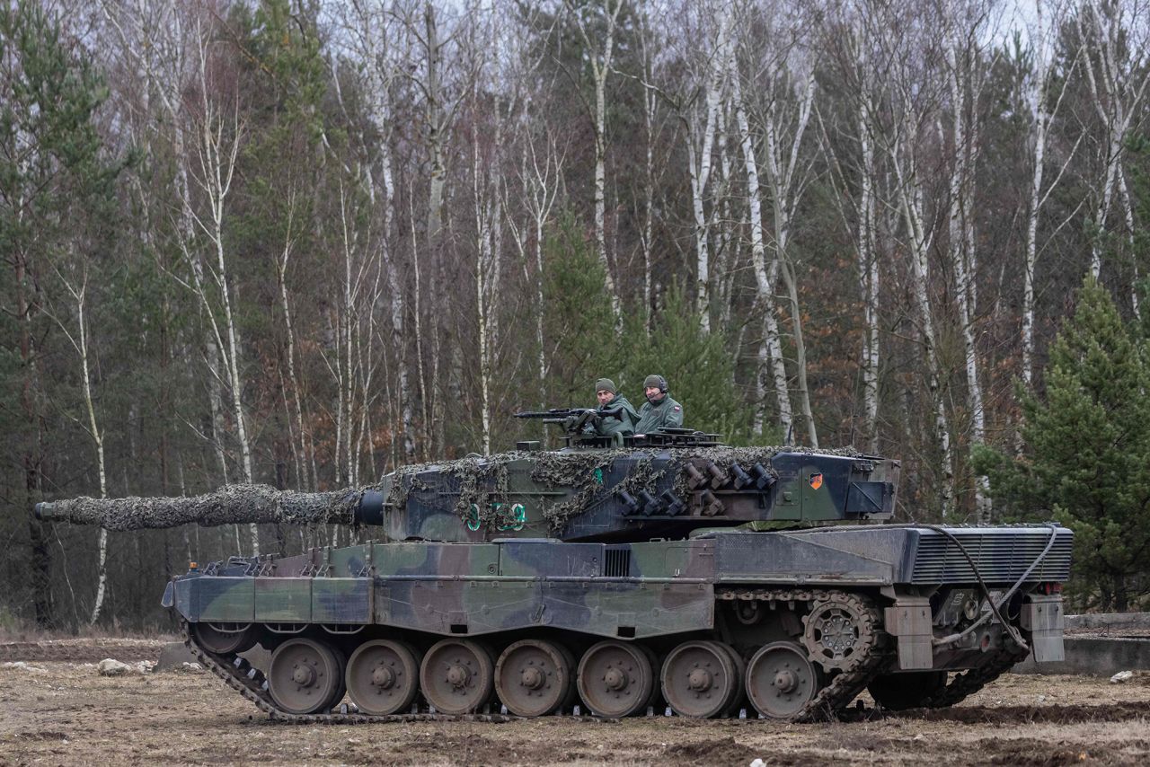 Polish and Ukrainian soldiers are seen on a Leopard 2 tank during a training at the Swietoszow military base in western Poland, on February 13.