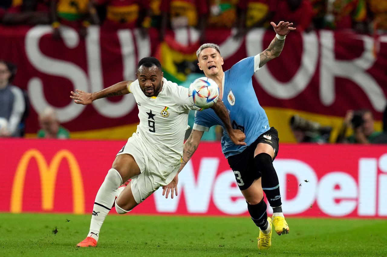 Ghana's Jordan Ayew, left, and Uruguay's Guillermo Varela fight for the ball on Friday.