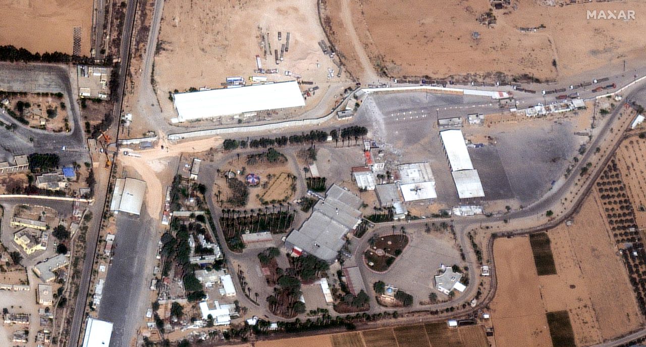 Trucks cross back into Egypt from the Gaza side of the Rafah crossing.