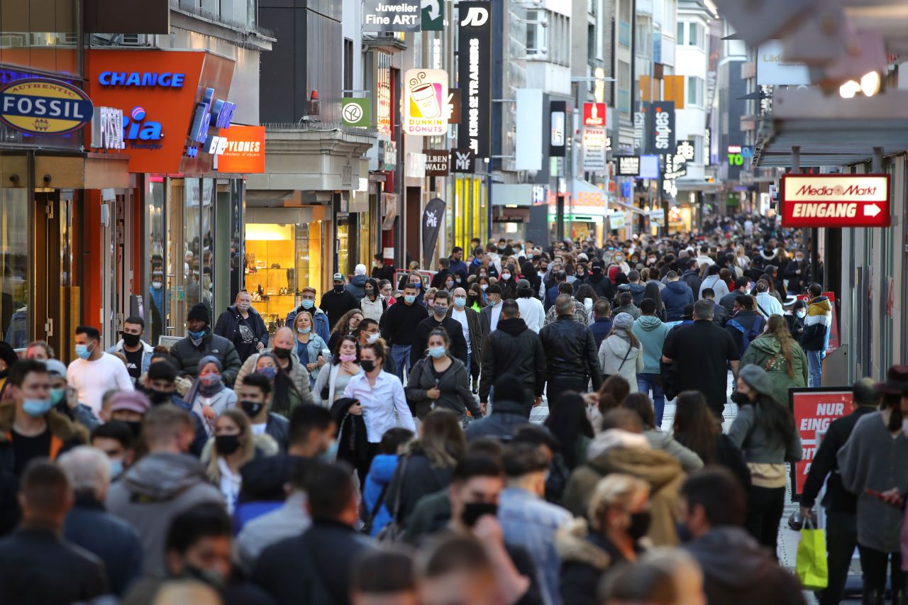 People are seen in Cologne's city center during the second wave of the coronavirus pandemic on October 31, 2020. 