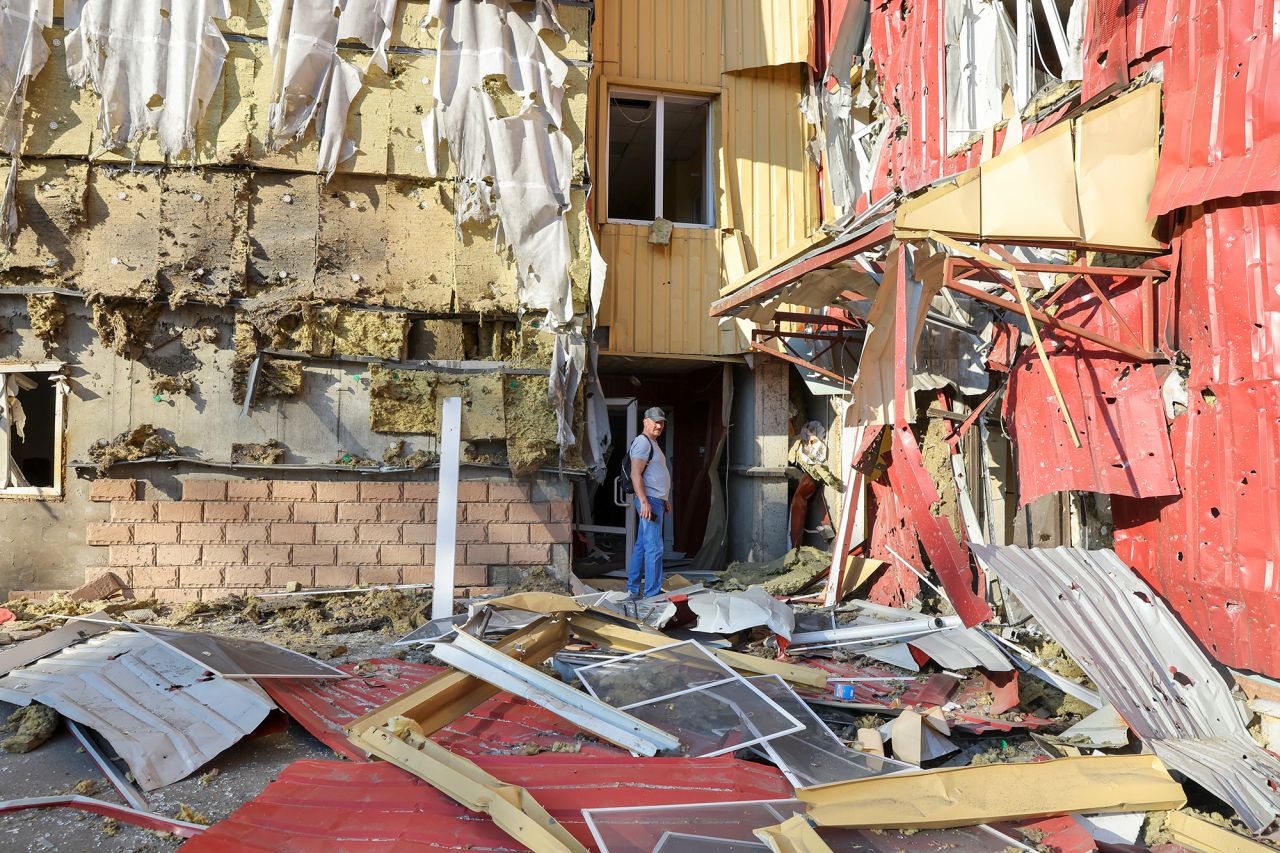 A man stands outside a damaged residential building following recent shelling in?Donetsk, Ukraine, on June 20.