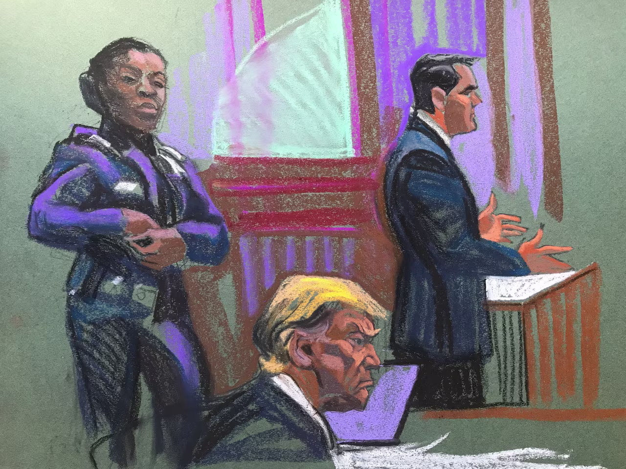 President Donald Trump sits while his lawyer Todd Blanche, right, speaks.