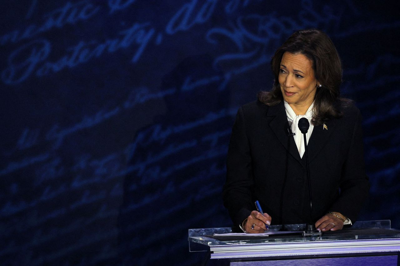 Harris listens during a presidential debate hosted by ABC as Republican presidential nominee, former U.S. President Donald Trump speaks, in Philadelphia on Tuesday.