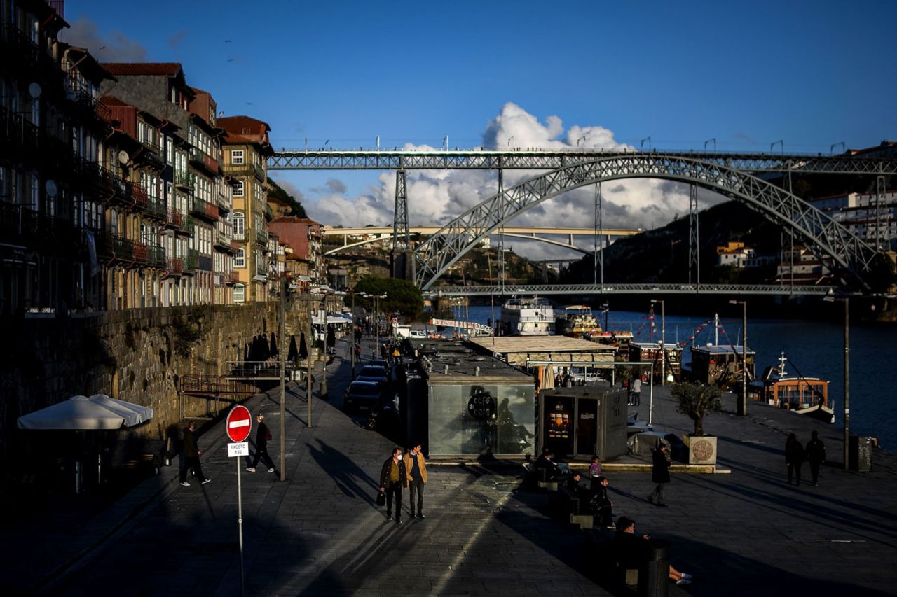 People wearing face masks are seen in downtown Porto, Portugal on October 21.