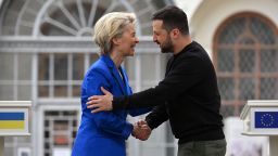 European Commission President Ursula von der Leyen shakes hands with Ukrainian President Volodymyr Zelensky, following their press-conference in Kyiv on May 9. 