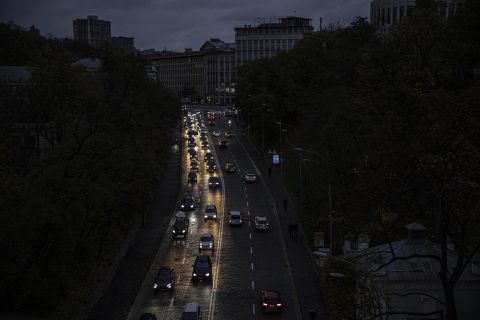 Cars move along a dark road during the energy conservation on Thursday, October 20, 2022, in Kyiv, Ukraine.