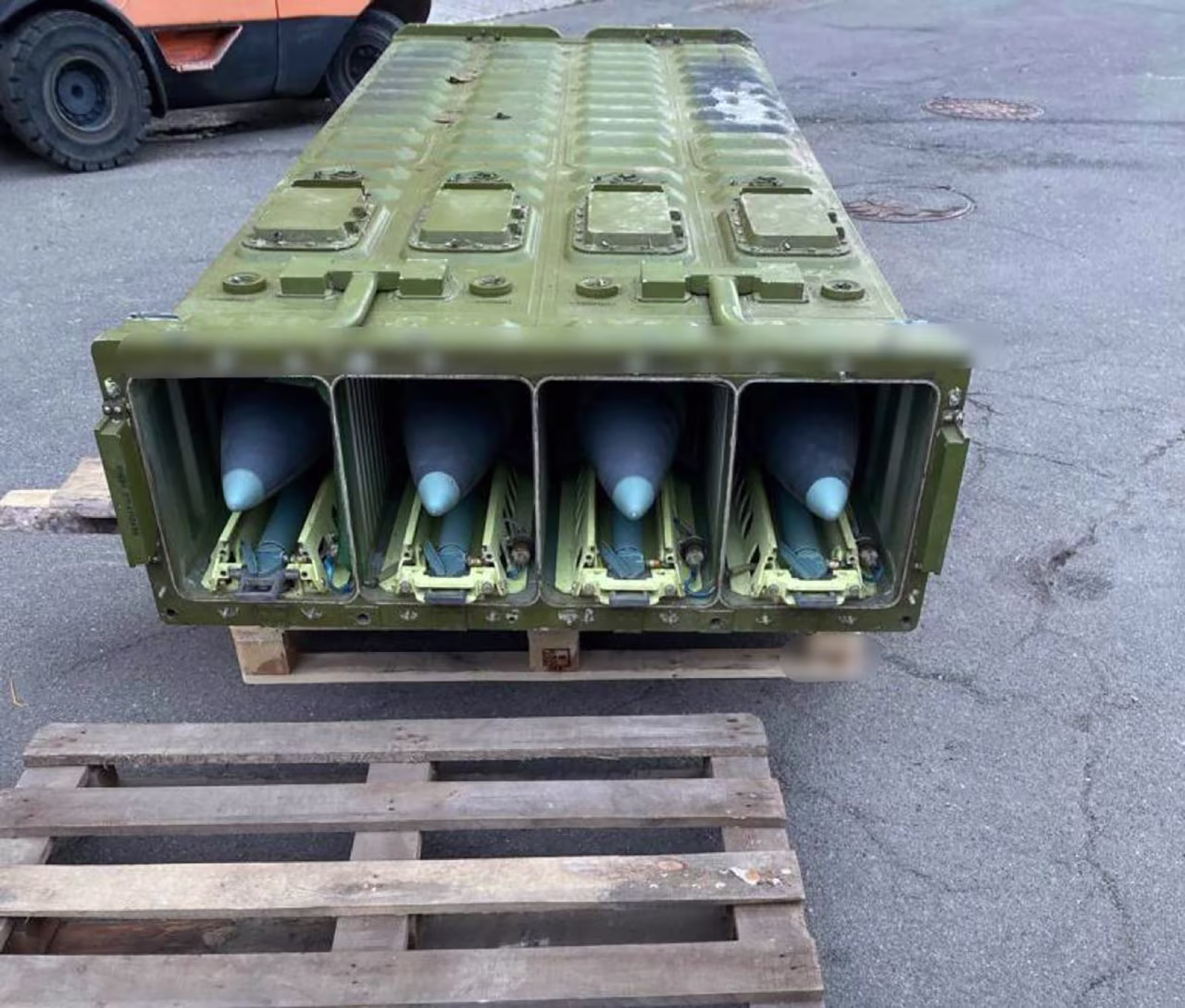 Weapons believed to have been left behind by Russian troops. Portions of this photo have been blurred by the source. 