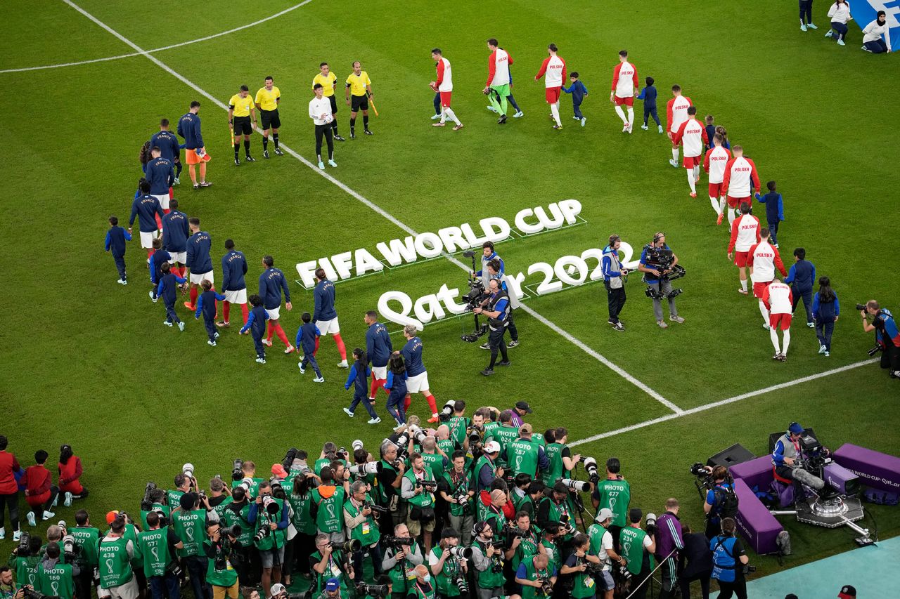 Players arrive on the pitch for the match between France and Poland on Sunday, December 4. 