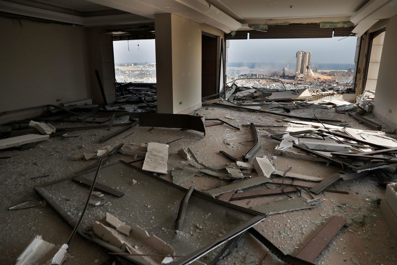 The site of the explosion is seen from a damaged apartment building in Beirut on August 5.