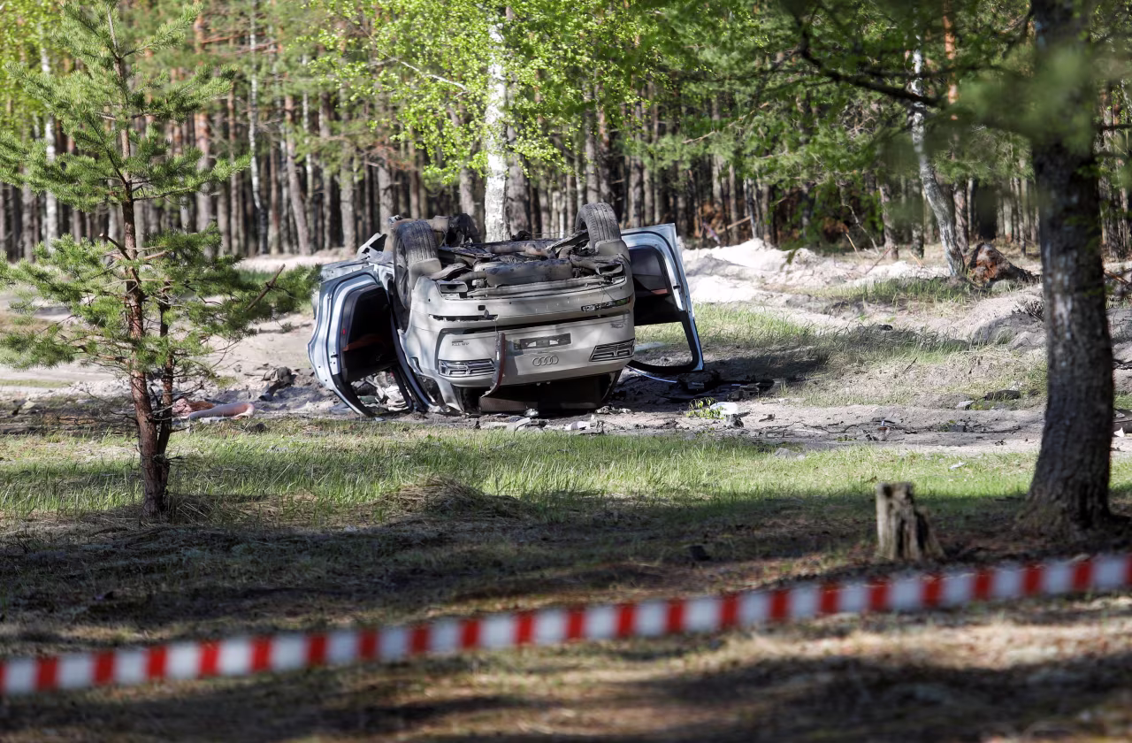 A damaged white Audi Q7 car is overturned after Russian military blogger Zakhar Prilepin was allegedly wounded in a bomb attack in Nizhny Novgorod, Russia, on May 6.