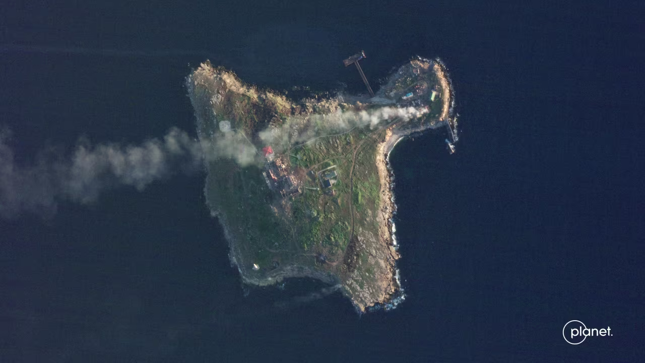 A satellite view shows smoke rising over Snake Island, on Sunday, May 8.