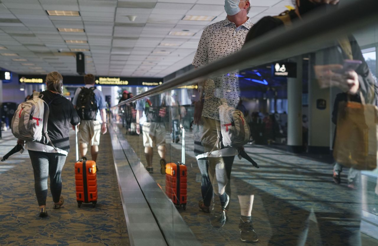 Travelers walk through the Charlotte Douglas International Airport in Charlotte, North Carolina, on June 4.