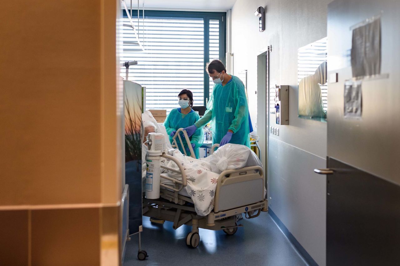 Swiss personnel help move a coronavirus patient at the Pourtales Hospital?in Neuchatel, Switzerland,?on March 25.