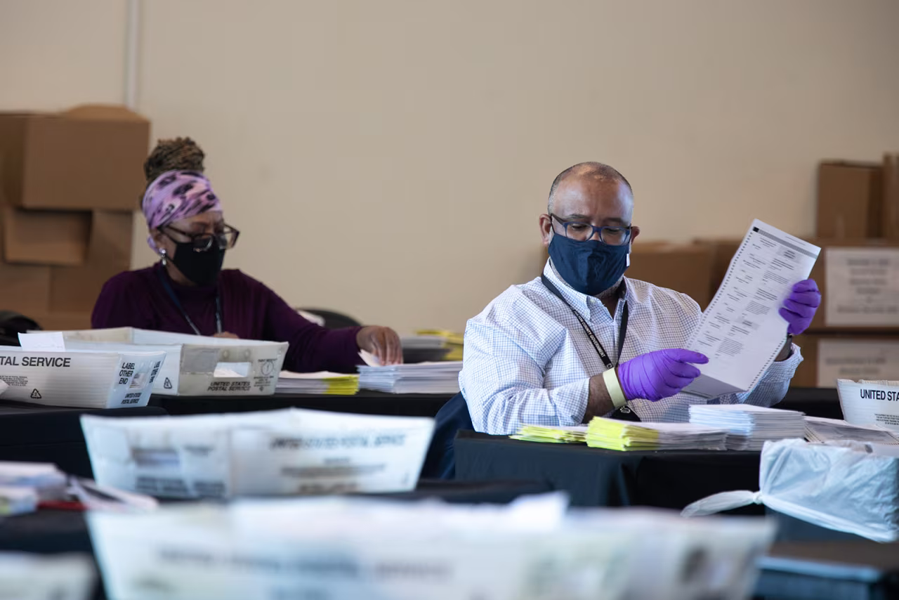 Election workers count Fulton County ballots at State Farm Arena in Atlanta, on November 4.