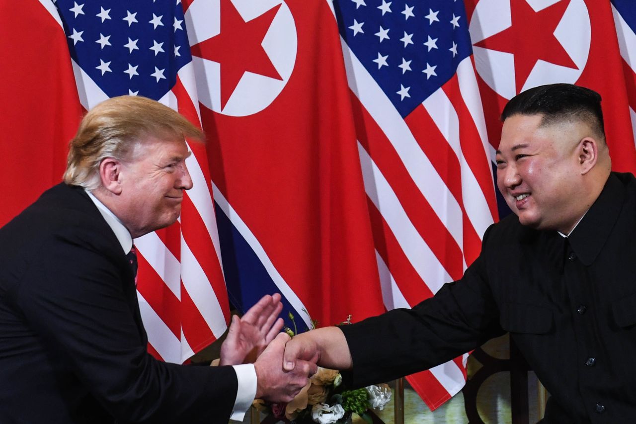 Trump shakes hands with Kim in Hanoi on Wednesday.  