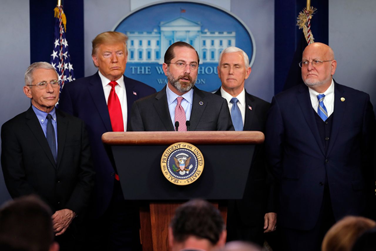 Health and Human Services Secretary Alex Azar speaks as National Institute for Allergy and Infectious Diseases Director Dr. Anthony Fauci, President Donald Trump, Vice President Mike Pence and Robert Redfield, director of the Centers for Disease Control and Prevention, listen, during a briefing about the coronavirus.