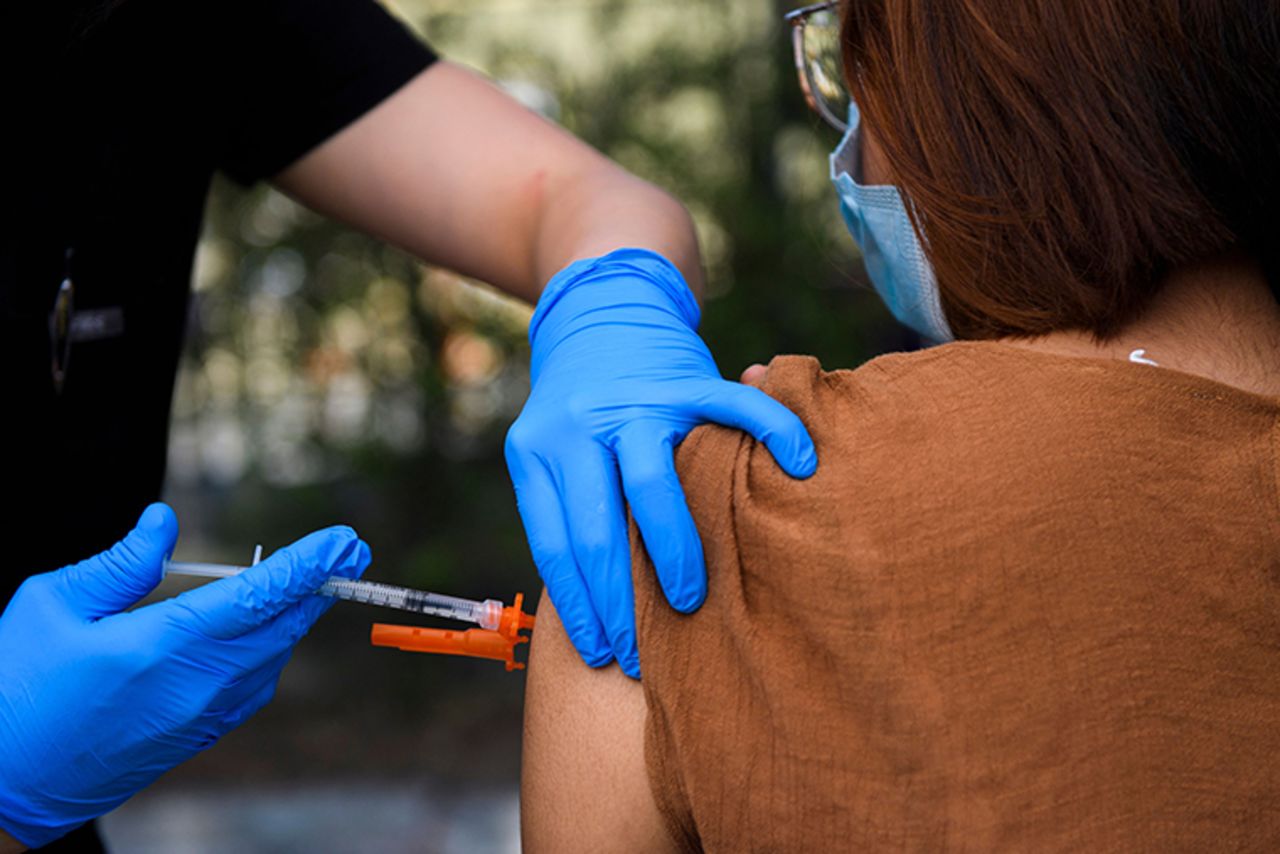 A 15-year-old receives a first dose of the Pfizer Covid-19 vaccine at a mobile vaccination clinic at the Weingart East Los Angeles YMCA on May 14, 2021 in Los Angeles, California.?