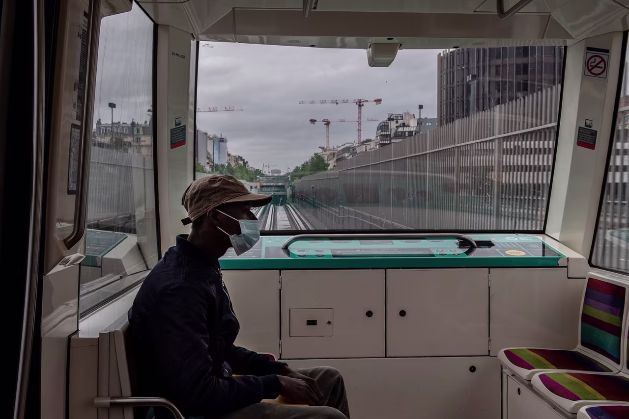 A commuter wearing a mask rides on the metro in Paris on May 11.