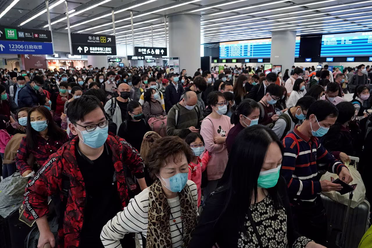 Passengers wait in the departure hall of the high speed train station in Hong Kong on January 23.