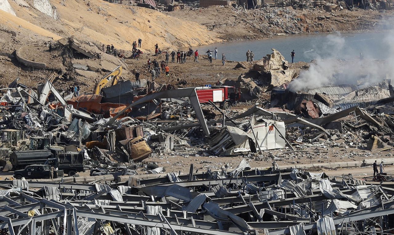 Rescue workers and security officers work at the scene of an explosion causing damage to the seaport of Beirut, Lebanon, on Wednesday, August 5. 