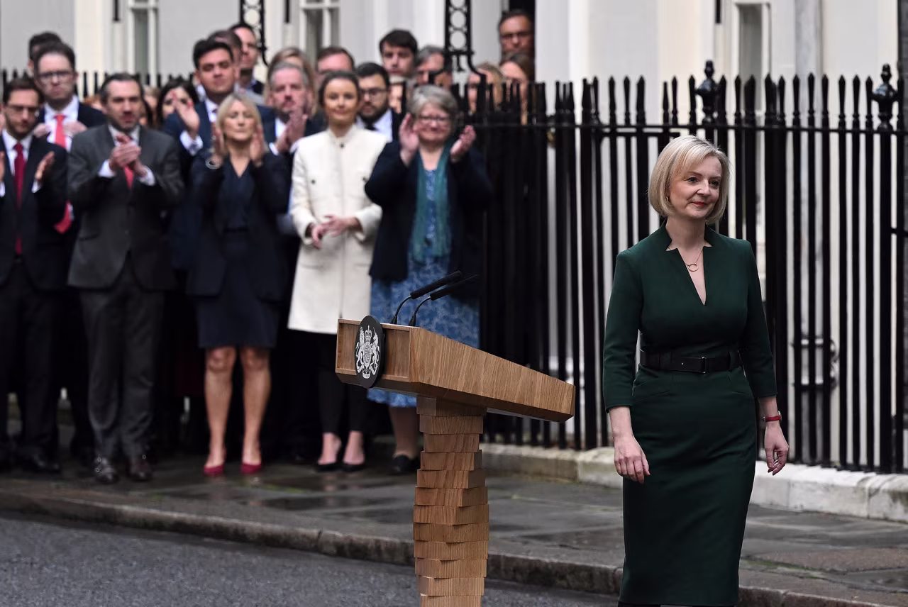Britain's outgoing Prime Minister Liz Truss walks away from the podium after delivering her final speech outside 10 Downing Street in central London, Tuesday, before heading to Buckingham Palace to give her resignation.