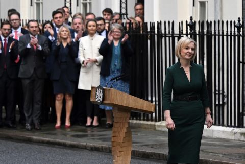 Britain's outgoing Prime Minister Liz Truss walks away from the podium after delivering her final speech outside 10 Downing Street in central London, Tuesday, before heading to Buckingham Palace to give her resignation.