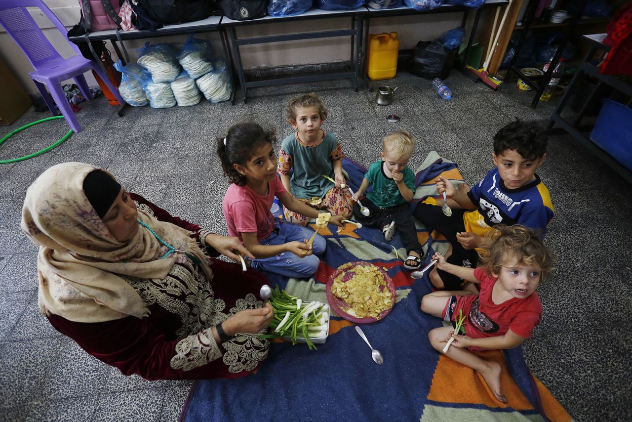 Palestinians take shelter at the United Nations relief and works agency for Palestine refugees in Gaza City on Thursday, October 12.