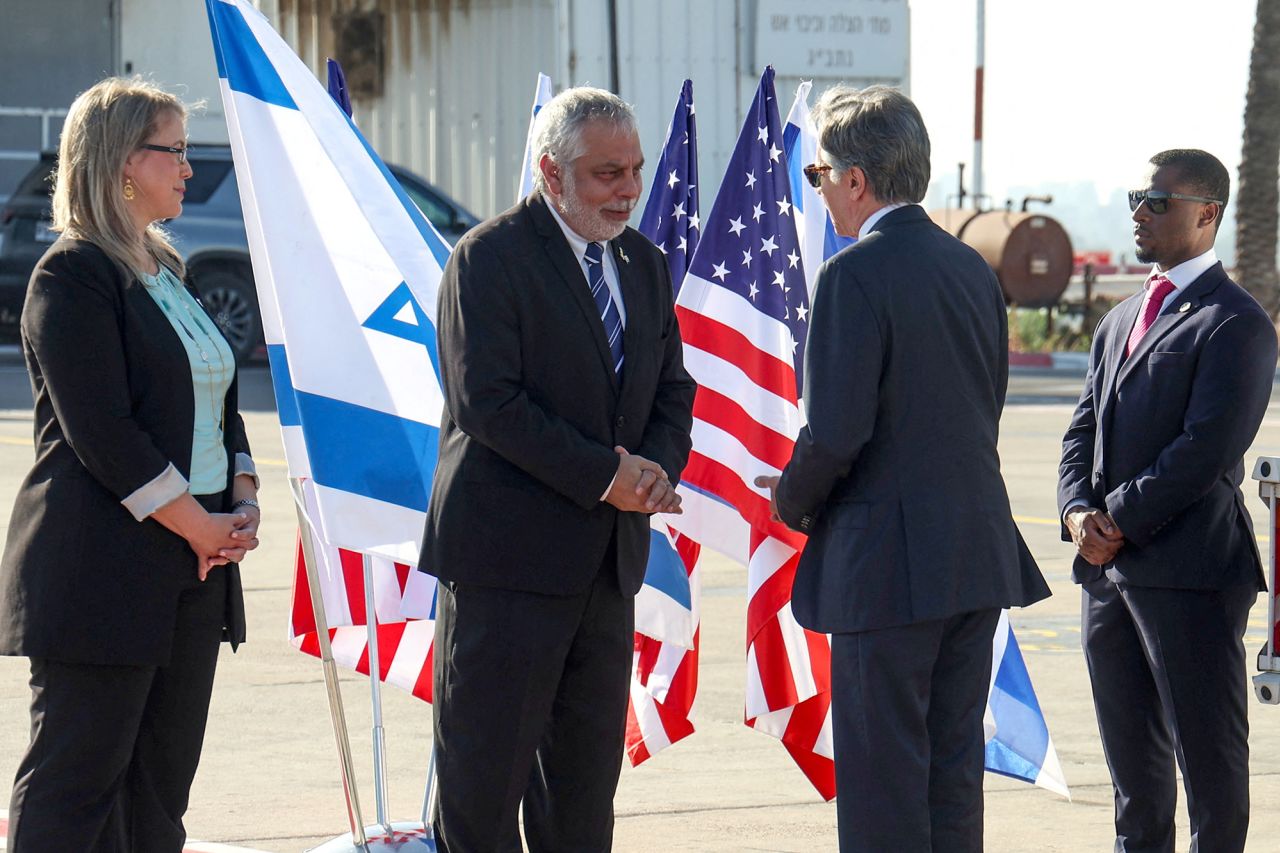 U.S. Secretary of State Antony Blinken greets an Israeli official upon his arrival at Ben Gurion airport near Tel Aviv, Israel, on June 10.