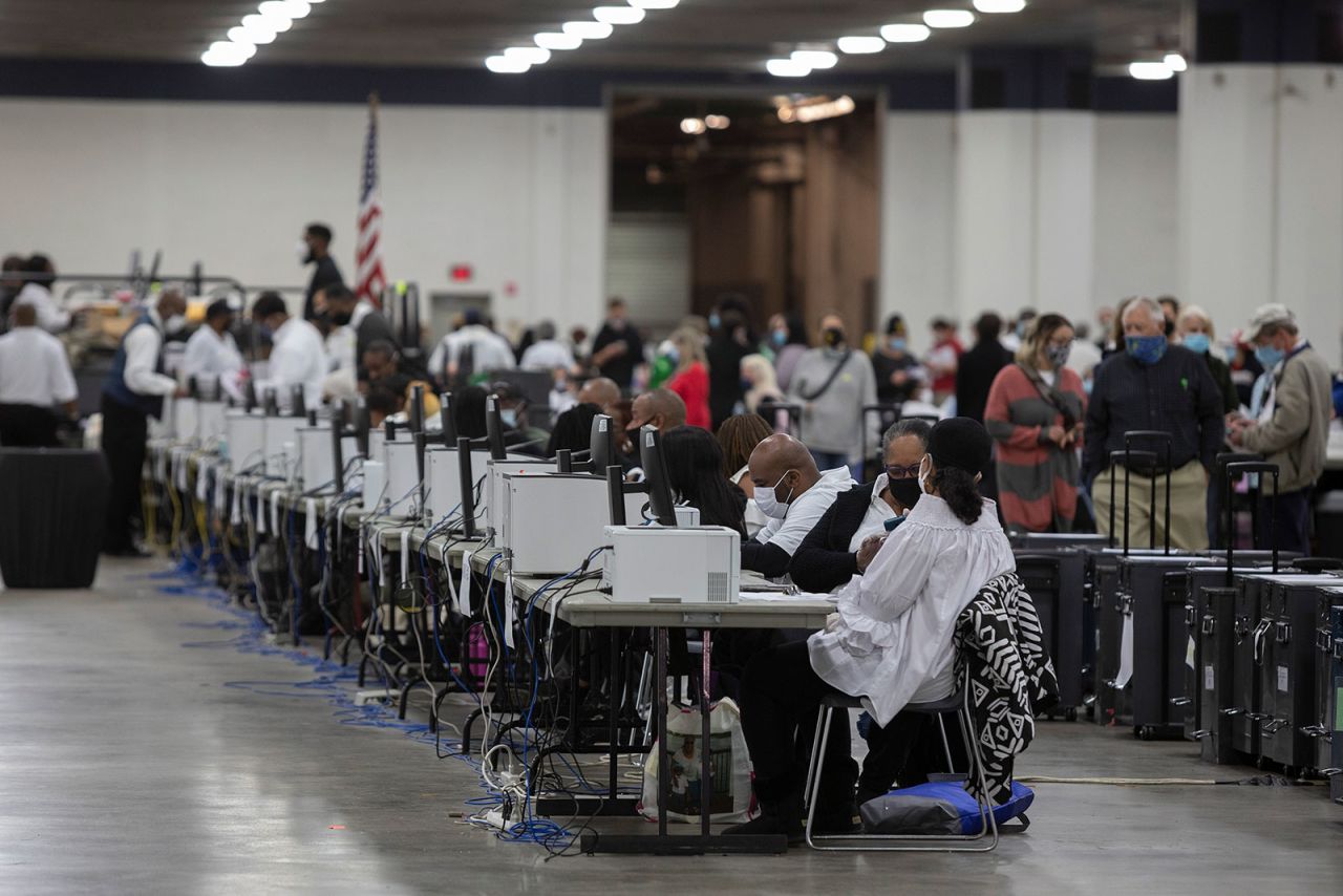 Workers with the Detroit Department of Elections help process absentee ballots at the Central Counting Board in the TCF Center in Detroit on November 4. 