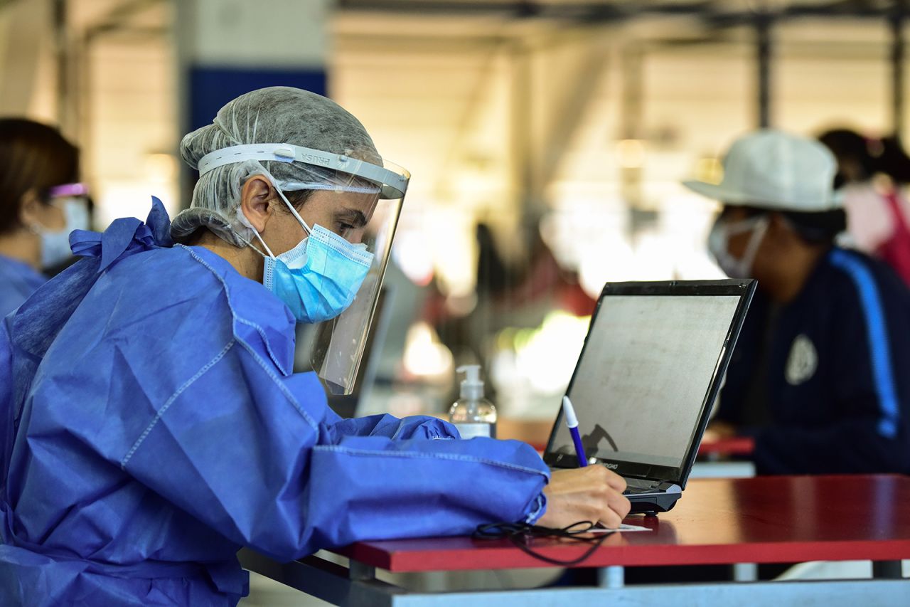 Health workers interview people with symptoms of Covid-19 at San Lorenzo's Pedro Bidegain Stadium on May 18, in Buenos Aires, Argentina.