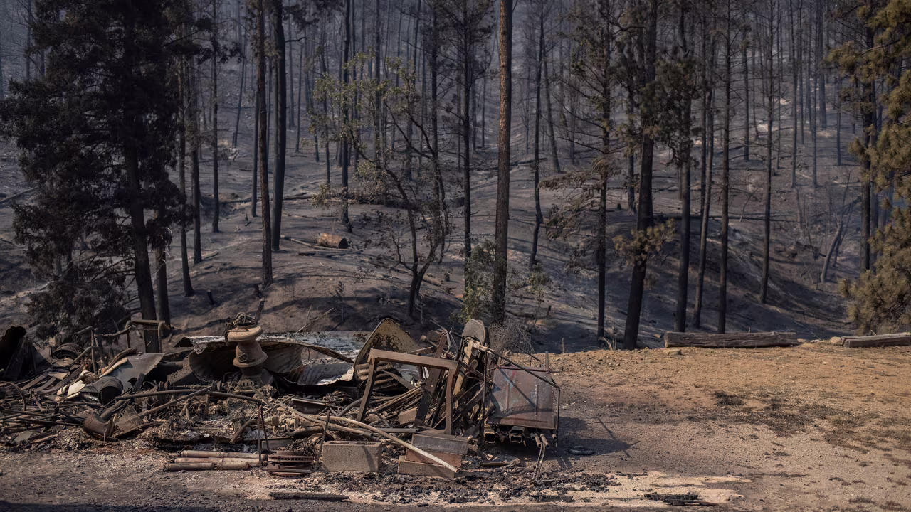 The remains of a residence are seen destroyed in the aftermath of the South Fork fire in Alto, New Mexico, on June 19