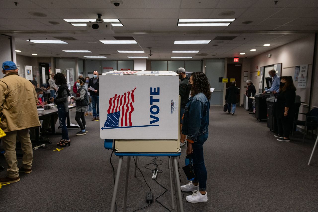 Voters cast their ballots at an early voting location in Fairfax, Virginia, on Saturday, October 30.