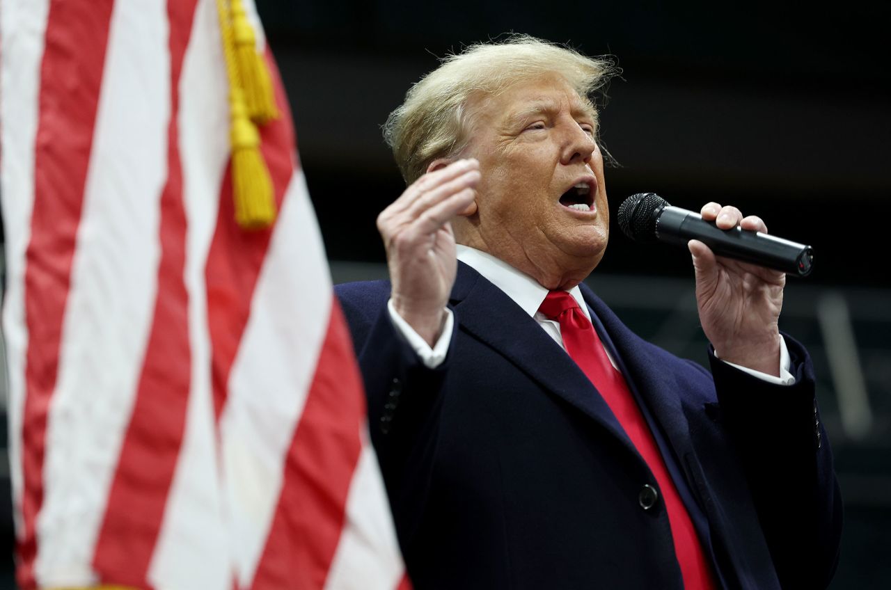 Former President Donald Trump speaks to voters during a visit to a caucus site at the Horizon Event Center on Monday in Clive.