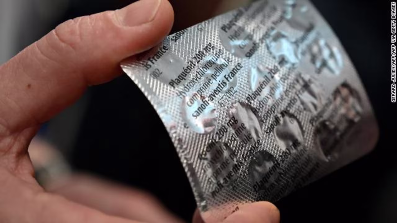 Medical staff shows on February 26, at the IHU Mediterranee Infection Institute in Marseille, a packet of Plaqueril, tablets containing hydroxychloroquine.
